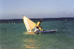Melanie still trying to get the sail up (she barely weighs enough)